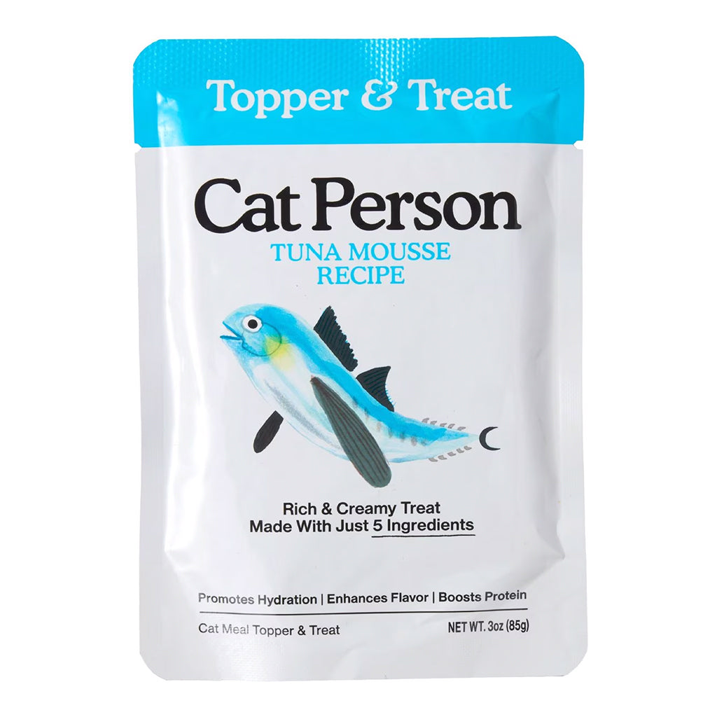 Front of a blue and white 3 oz Cat Person Tuna Mousse Recipe cat meal topper and treat pouch, with a tuna illustration.